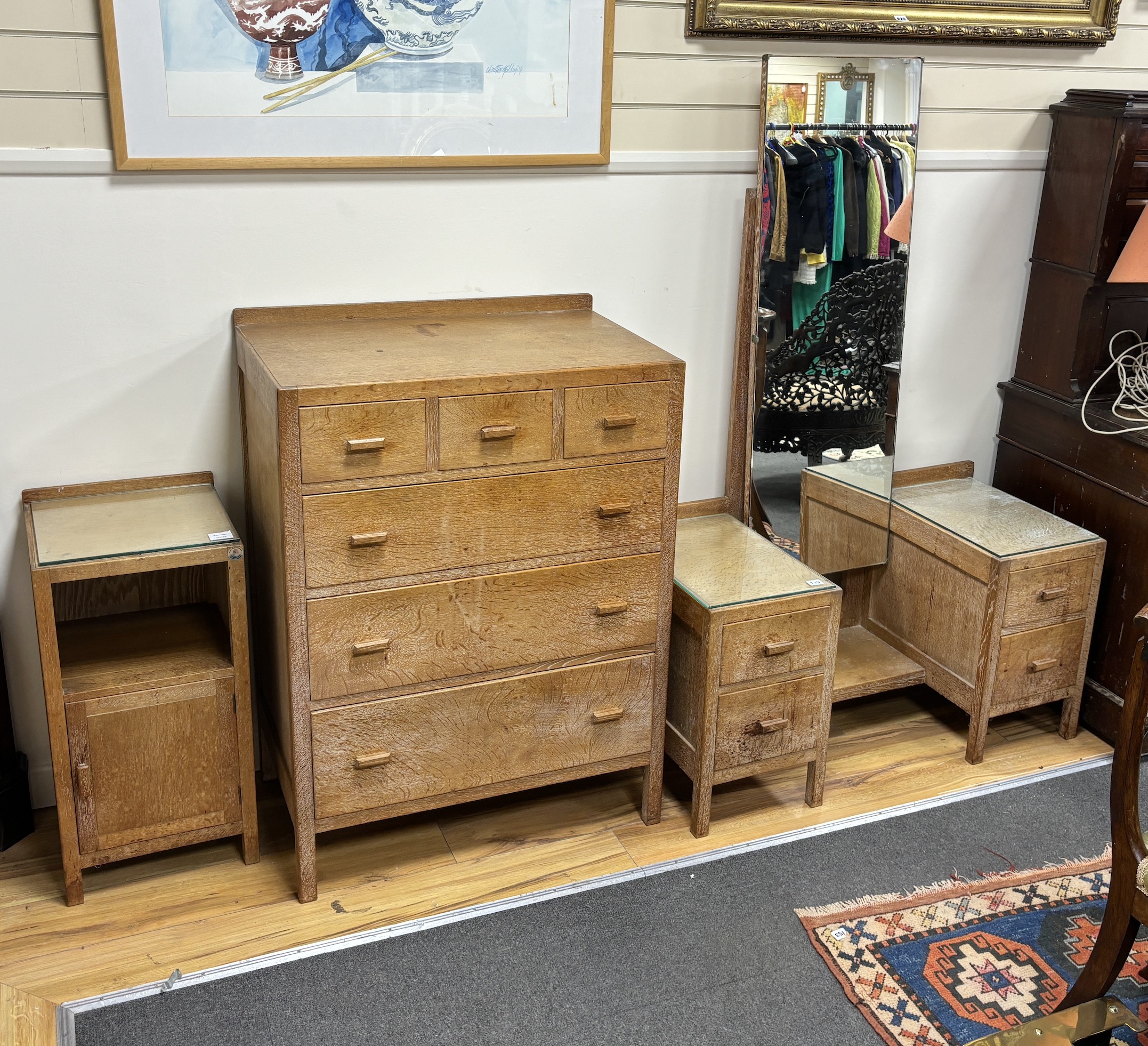 A Heals, London, limed oak six drawer chest, width 76cm, depth 48cm, height 104cm, dressing table and bedside cabinet